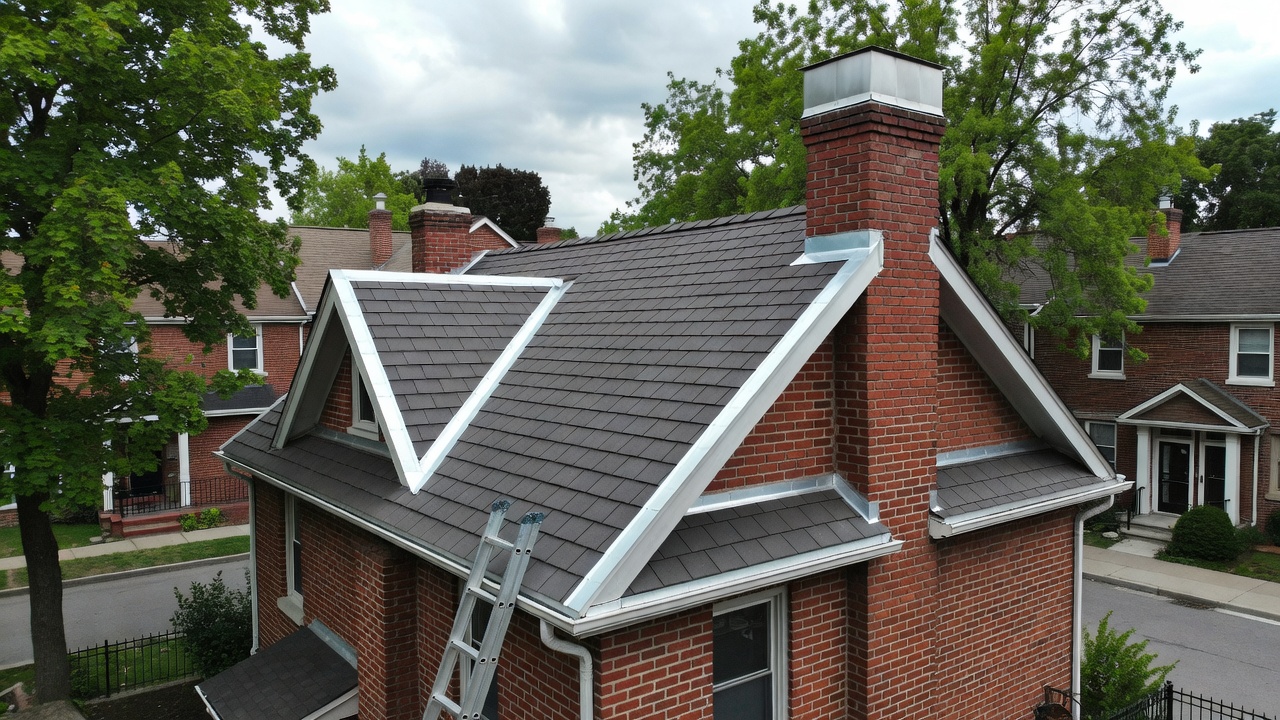 Chimney cap maintenance on Toronto townhouse roof